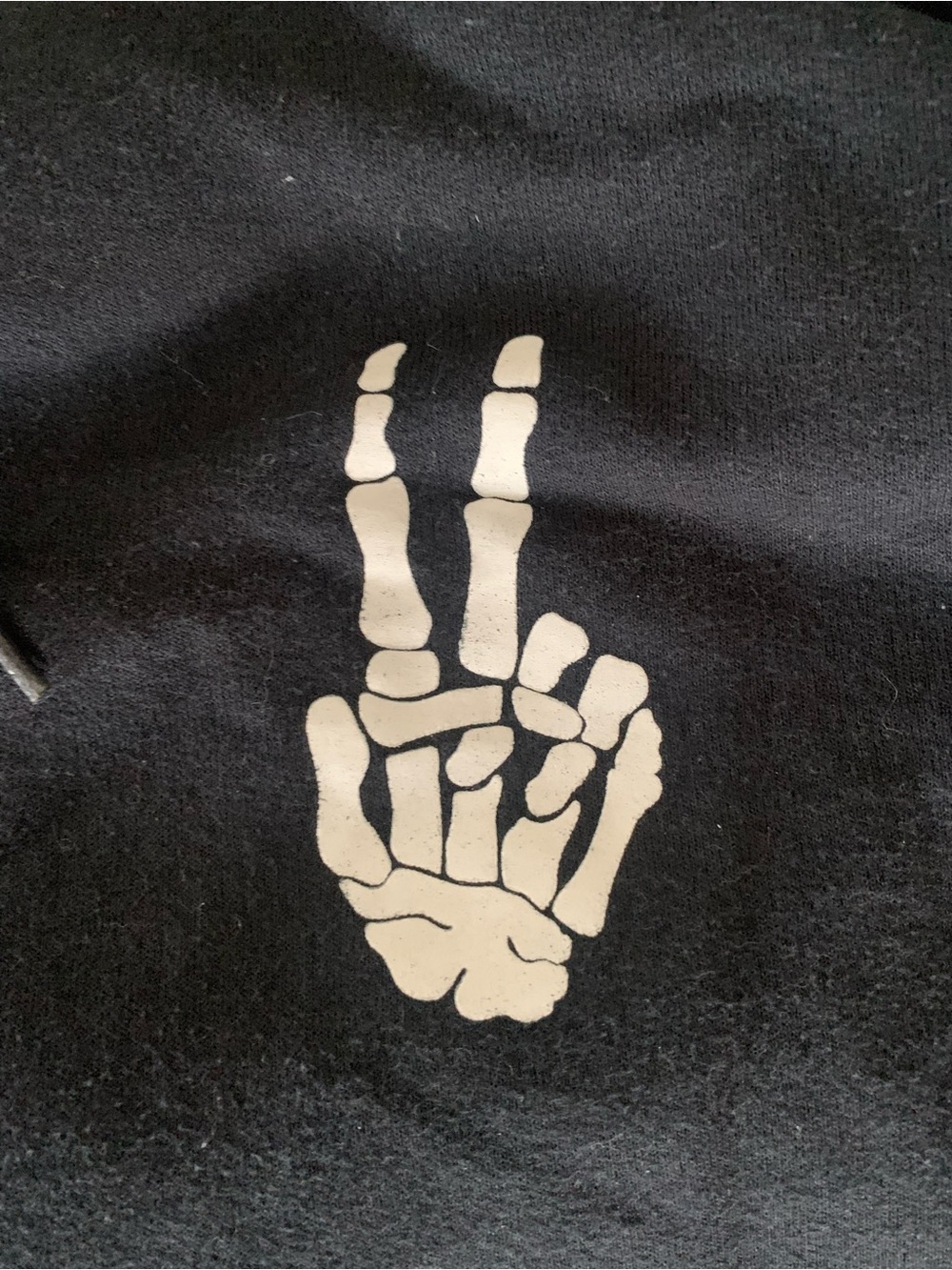 Women’s Black Pullover Hoodie with White Skeleton Peace-Hand Graphic